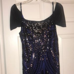 Black lace dress with sequins and blue stretchy lining. Size: L